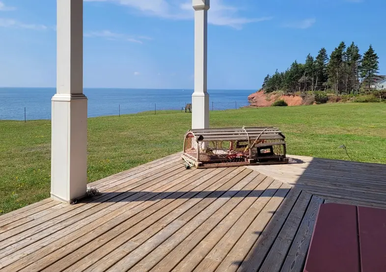 The deck boards and posts looking out to the strait